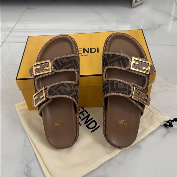 Authentic Fendi Tan and Black Logo Slide Sandals in excellent conditions.